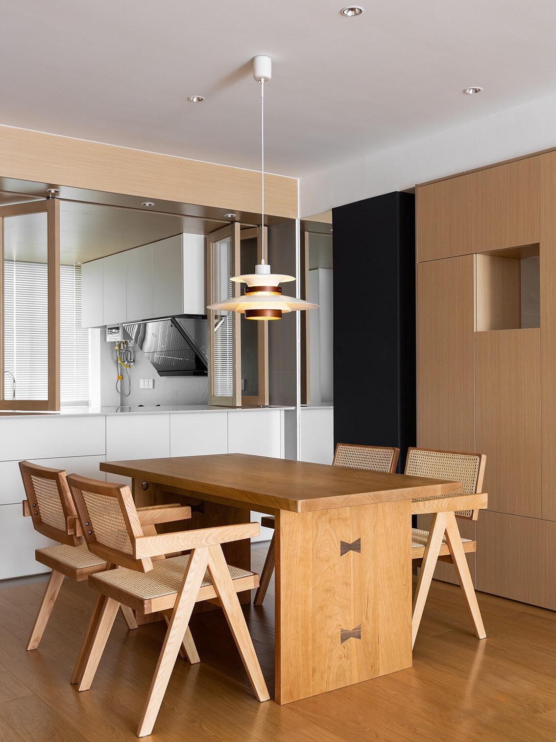 Pendant over a wooden dining table and bench