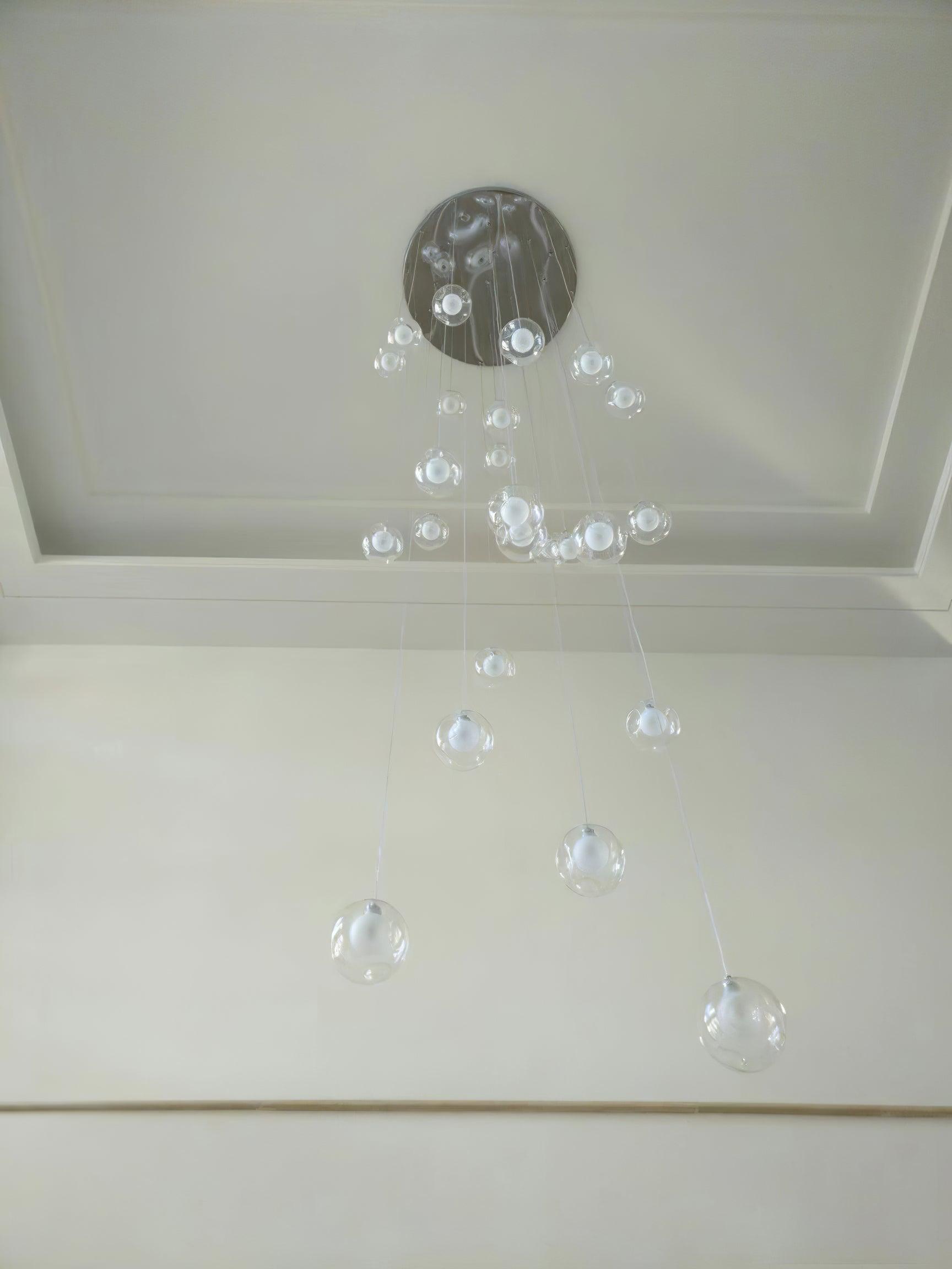 Unlit clear globes against pale wall