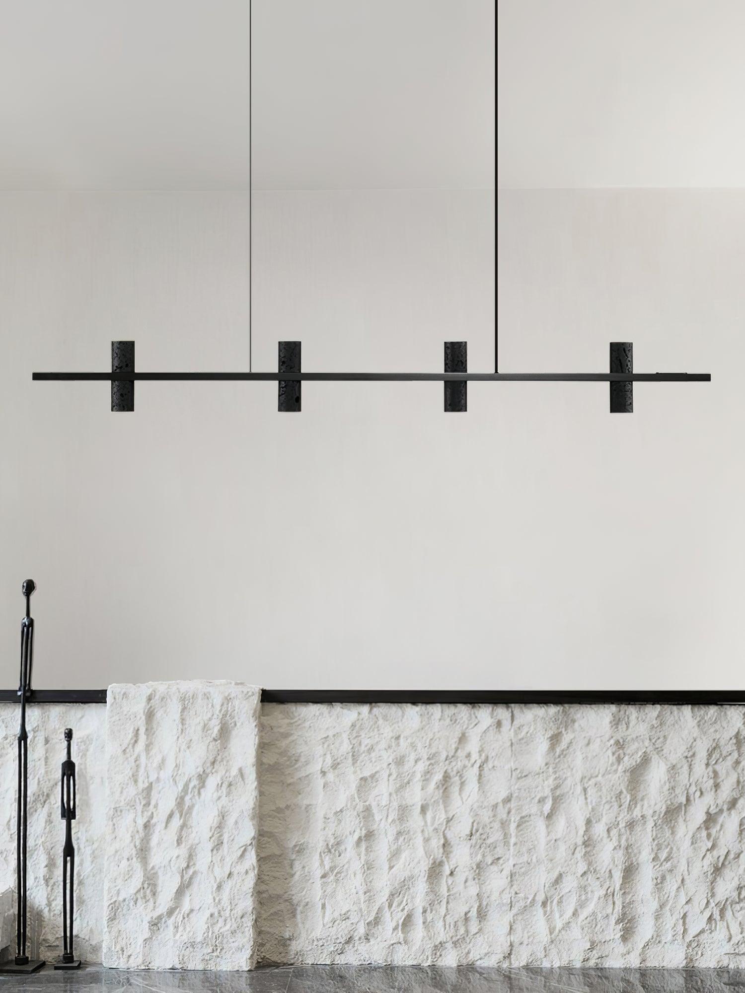 Black linear fixture suspended over an indoor counter