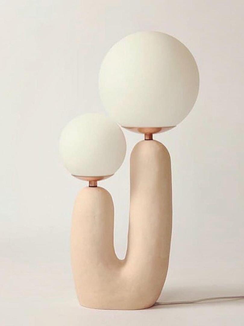 Pale beige U-shaped body and unequal White globes