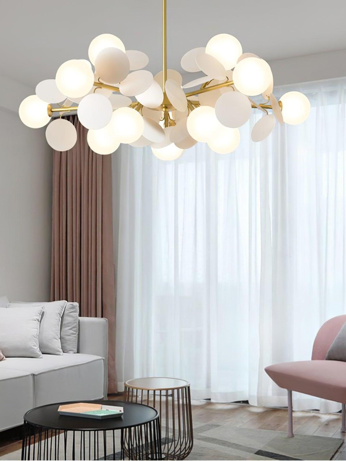 White globe chandelier near lounge windows
