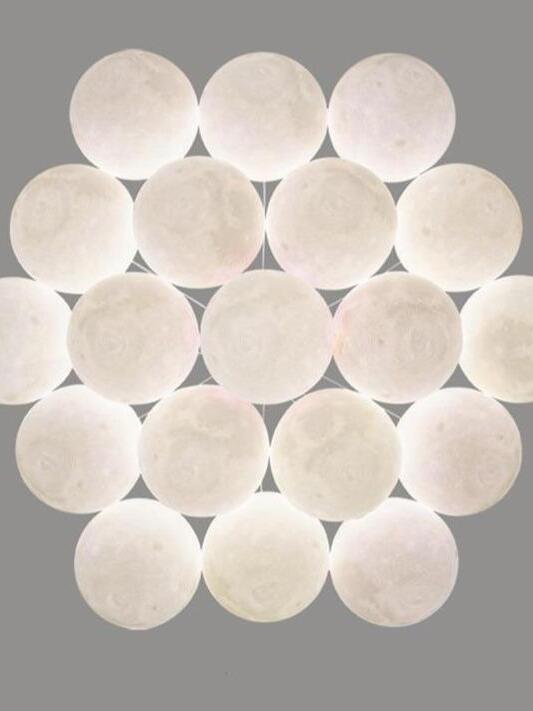 Underside arrangement of pale textured moon-like spheres