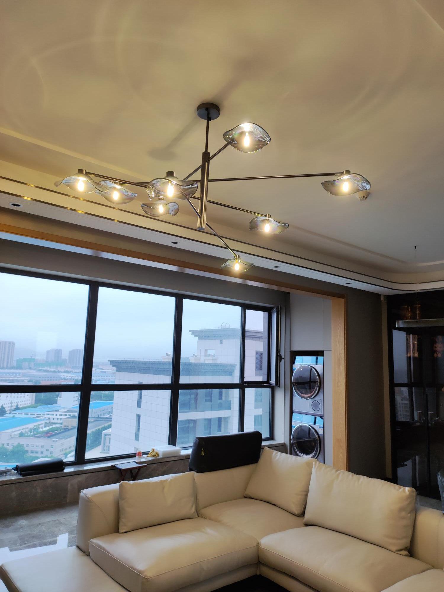 Installed Calla chandelier above a White sofa