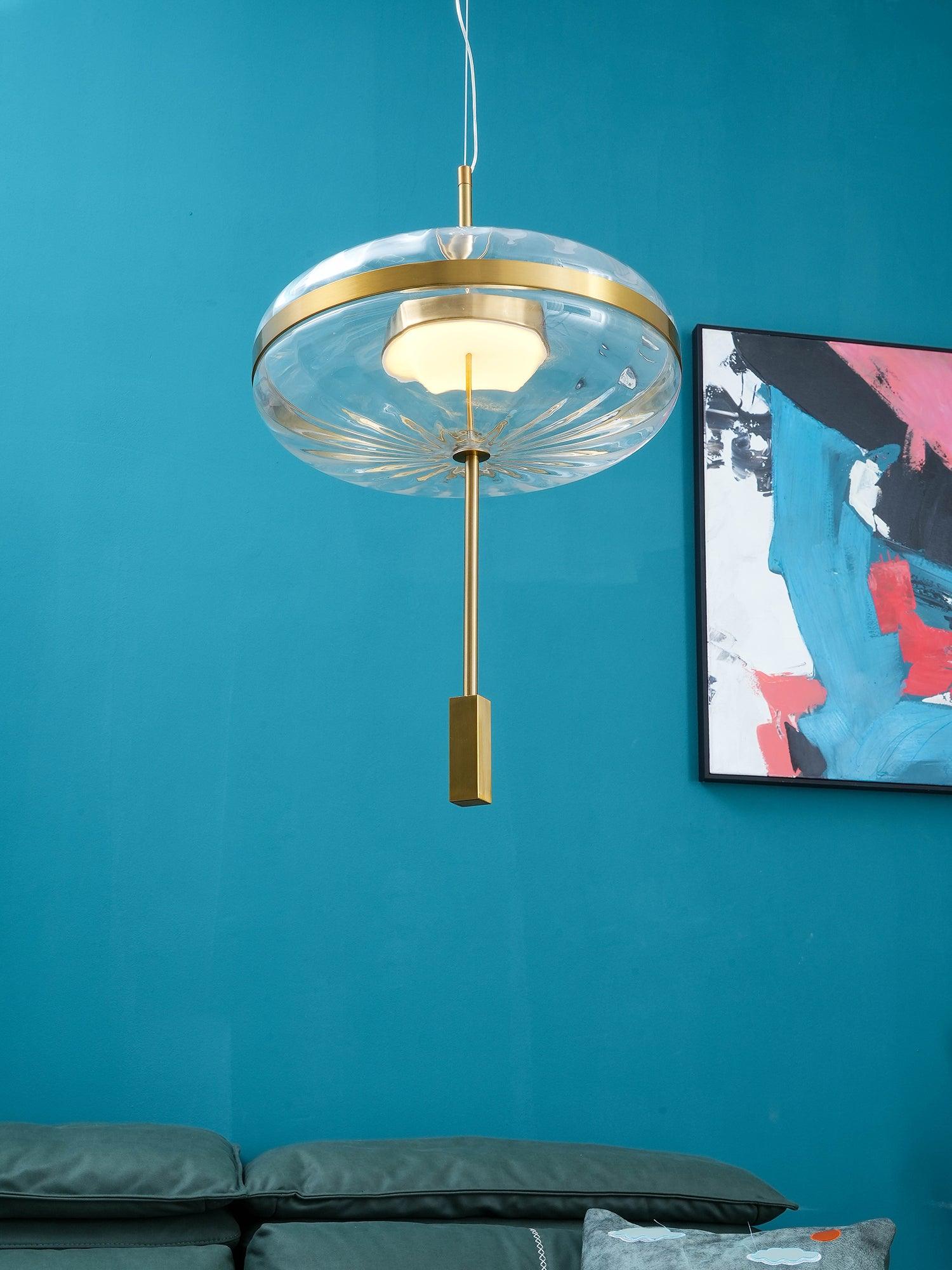 Jolie glass pendant against a blue wall