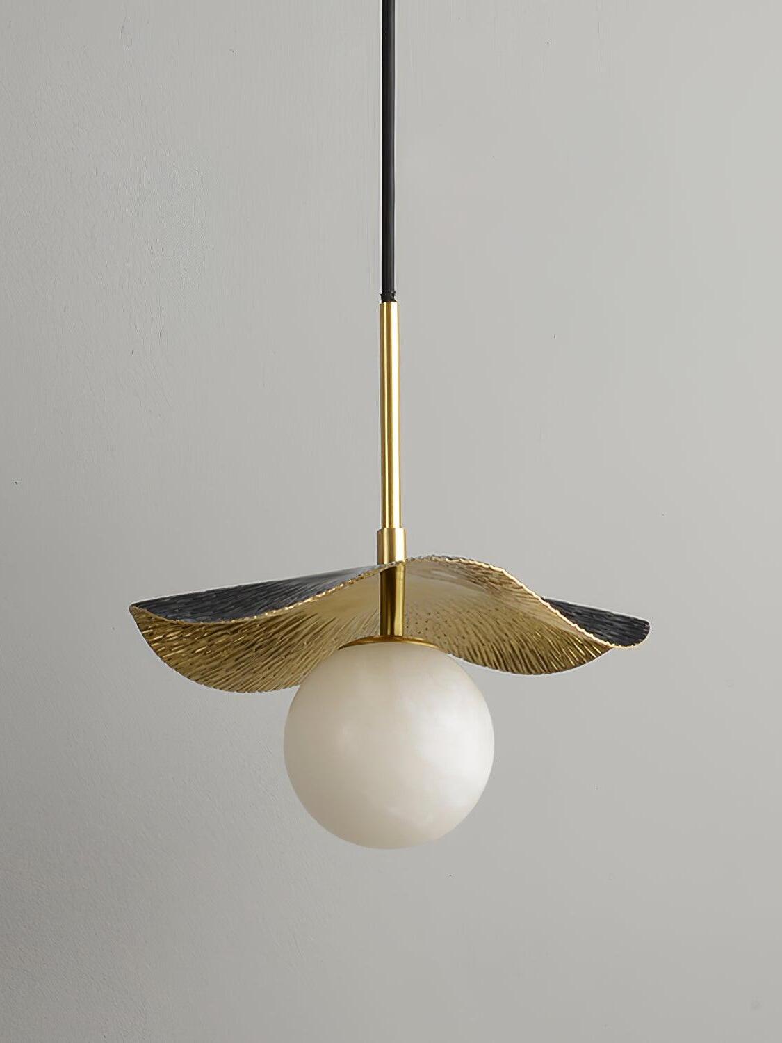 Black rippled leaf shade over unlit white globe