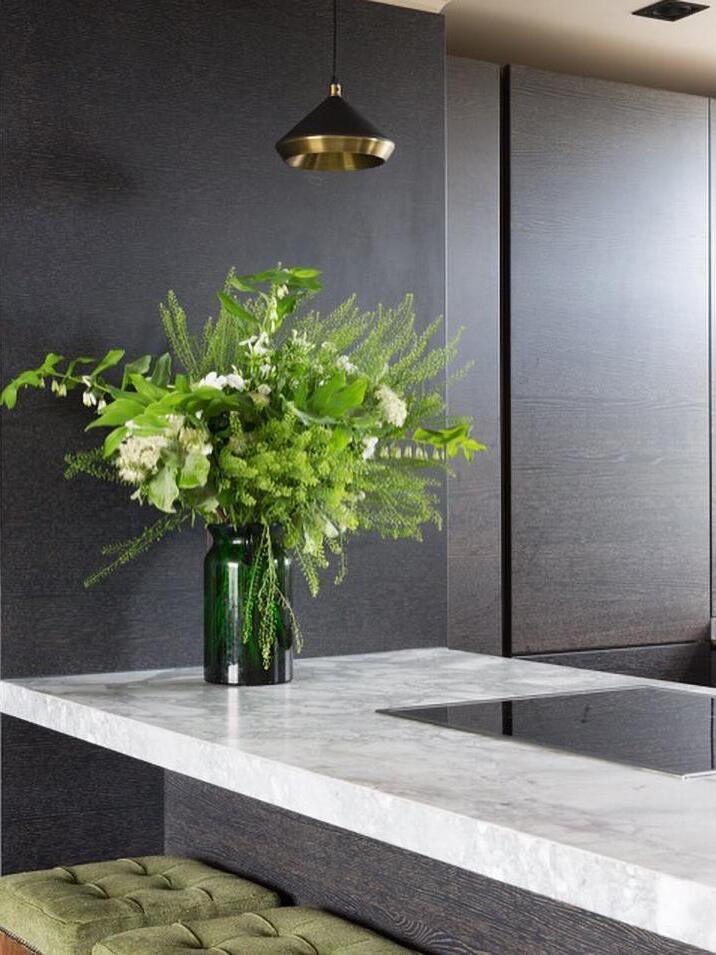 Single dark cone pendant above an indoor basin counter