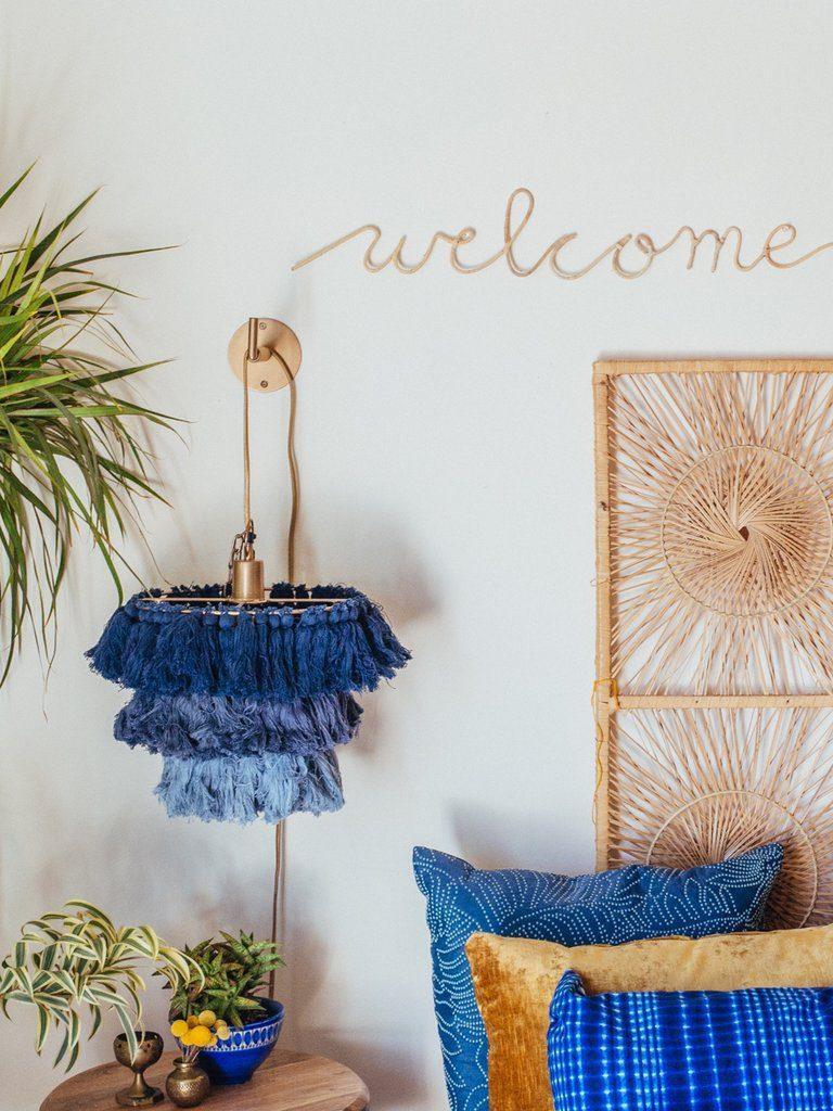 Blue tiered shade above a side table
