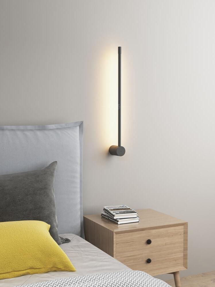 Short vertical rod above a bedside table
