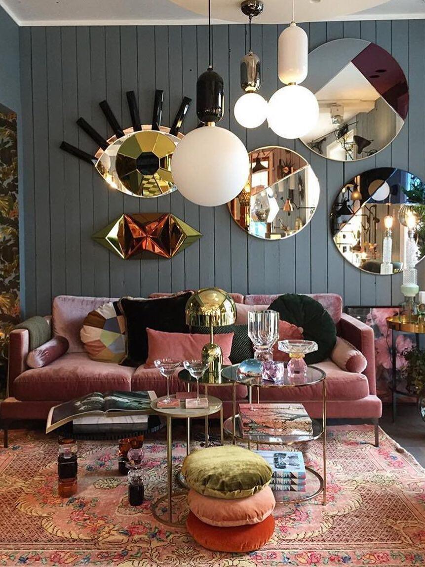 Grouped white globe pendants in a colourful living room