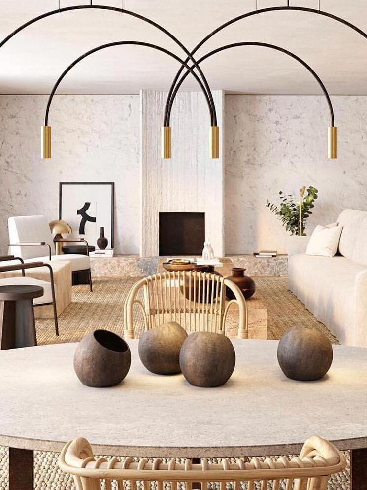 Overlapping Black arcs and Gold heads above dining furniture
