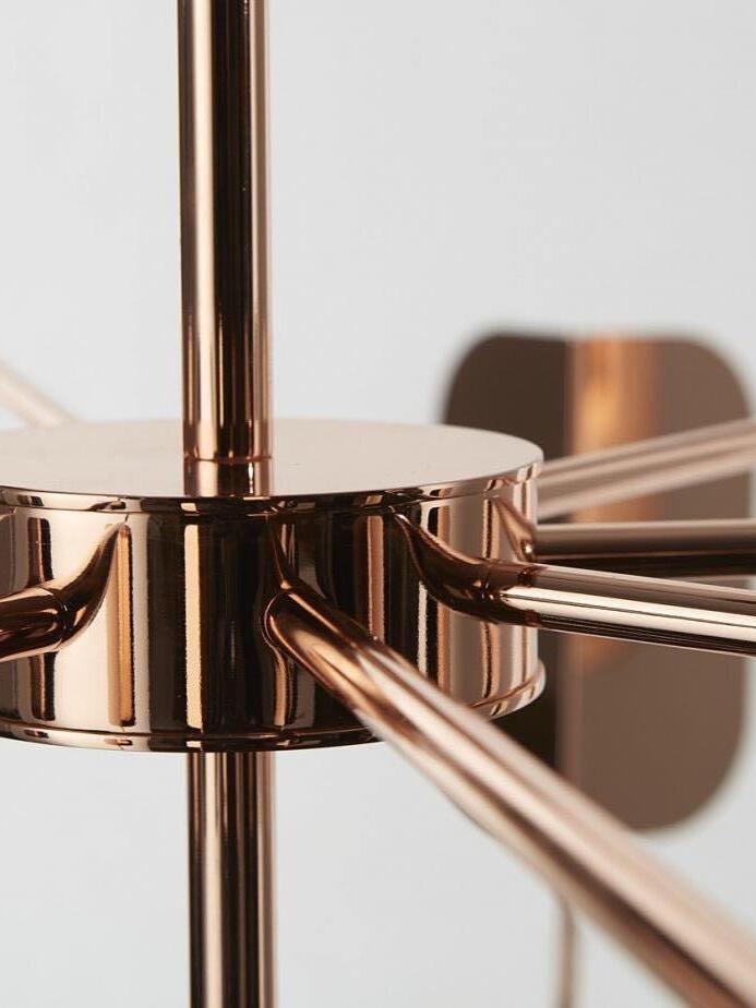 Rose-gold-coloured central stem and arm junction