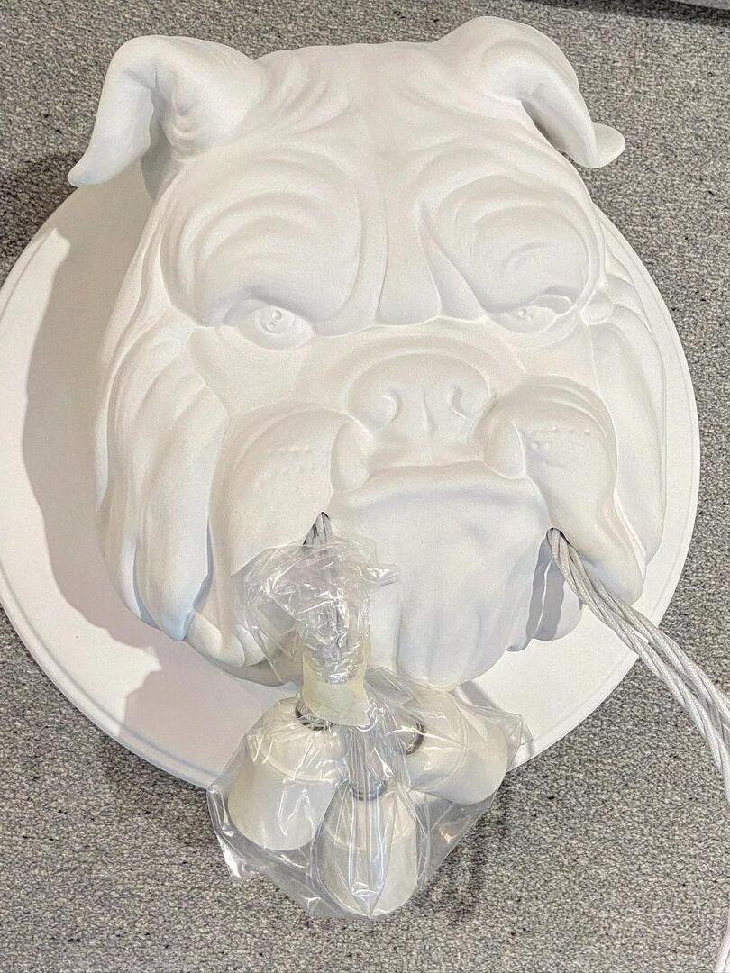 White bulldog fixture resting on packing material