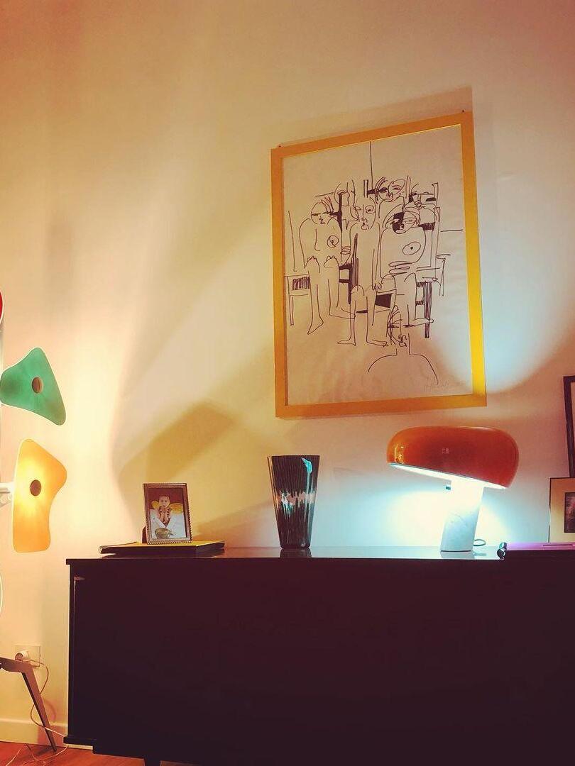 Partial green panel beside a cabinet and separate lamps