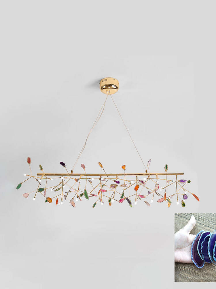 Long linear reference chandelier with dark blue stone inset