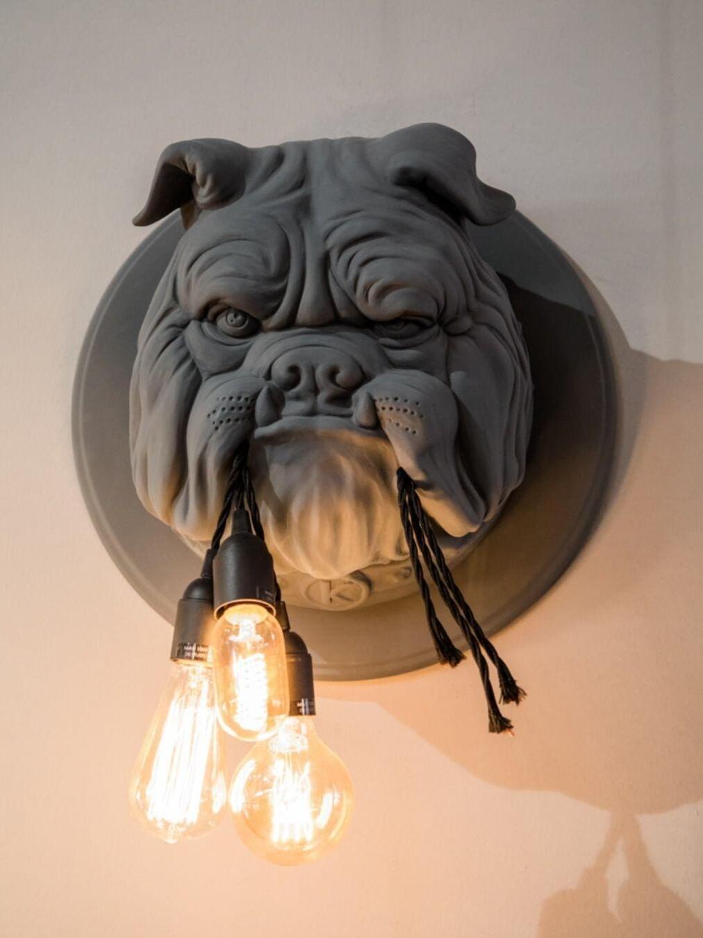 Dark bulldog head with glowing filament-style bulbs