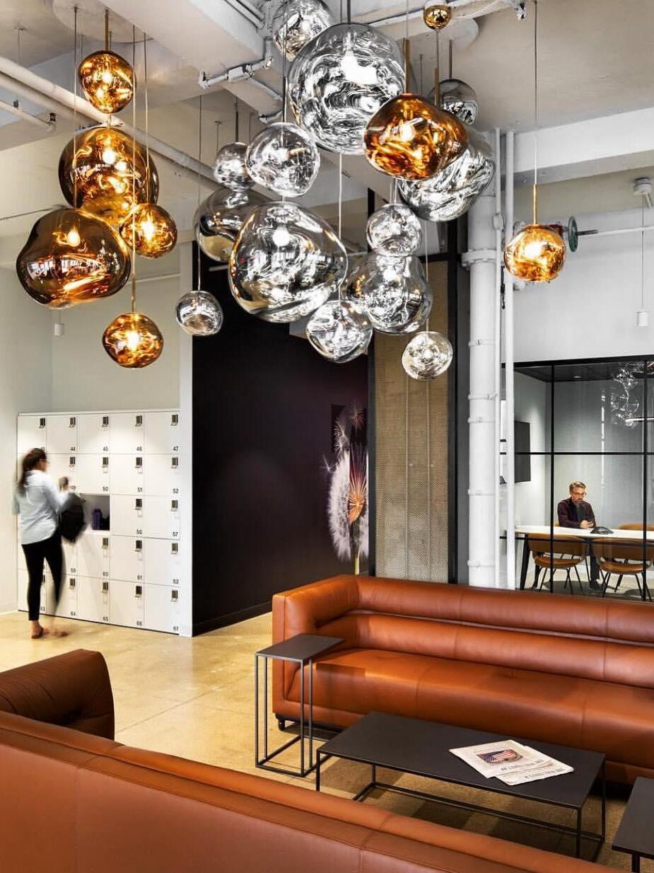 Mixed metallic-looking pendant group in an interior