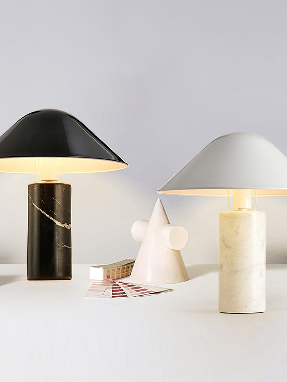 Black and white Adelaide lamps lit side by side