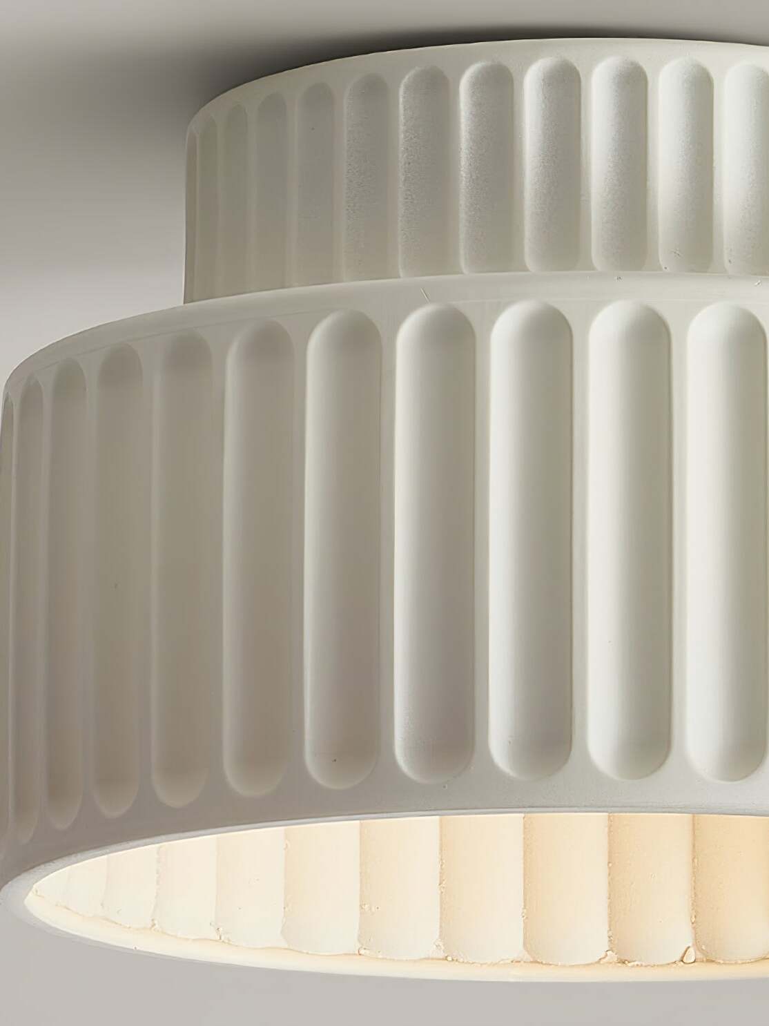 Close white vertical fluting and open lower edge