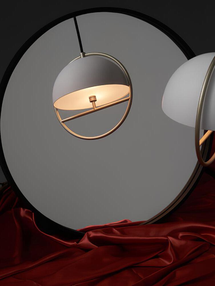 Black ring pendant in round mirror display