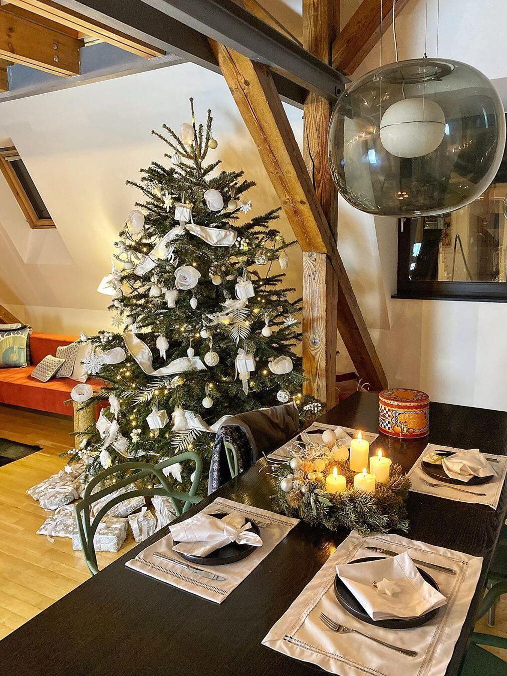 Smoked glass pendant above a festive dining table