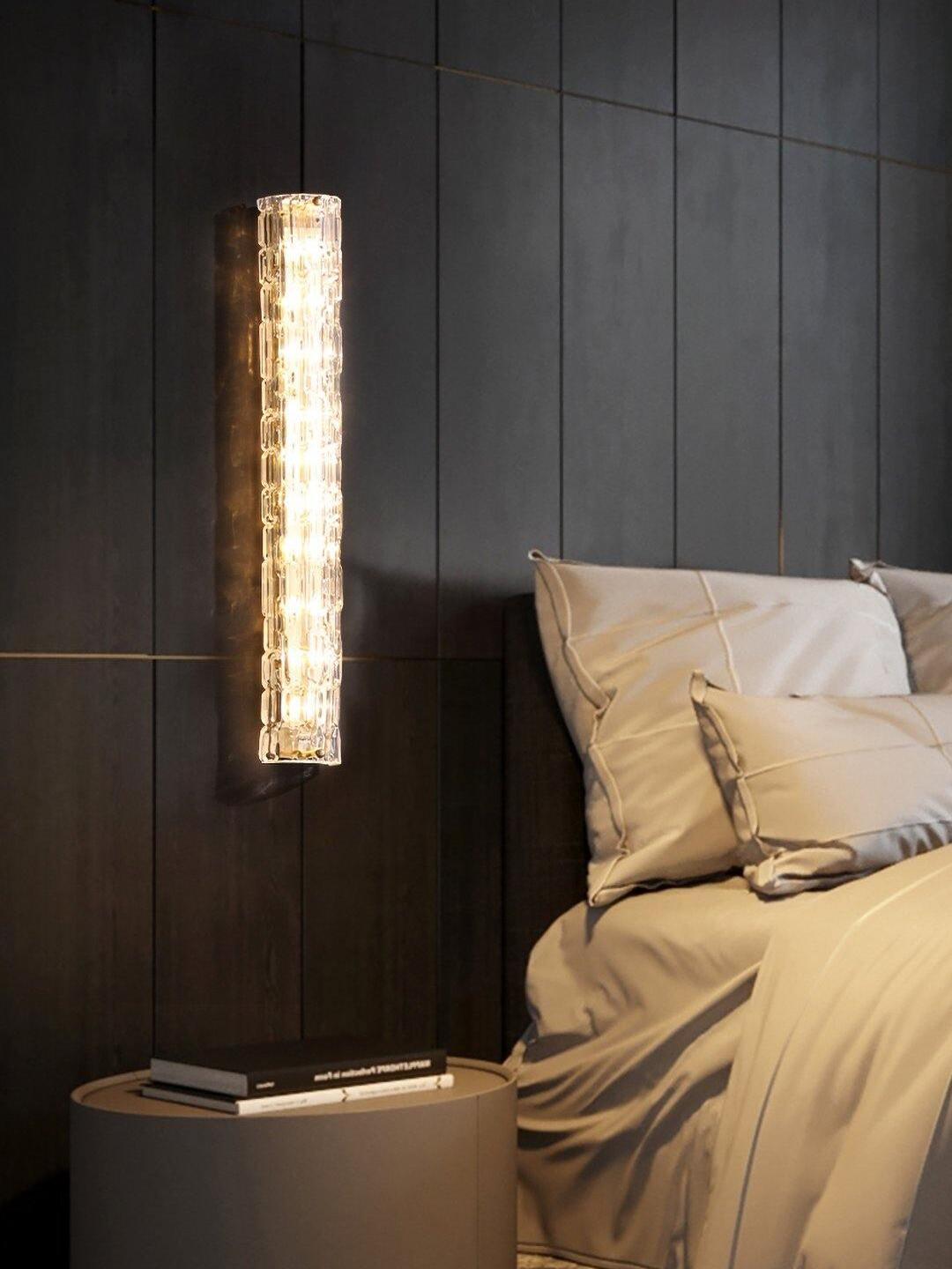 Vertical textured glass light beside bed and bedside table