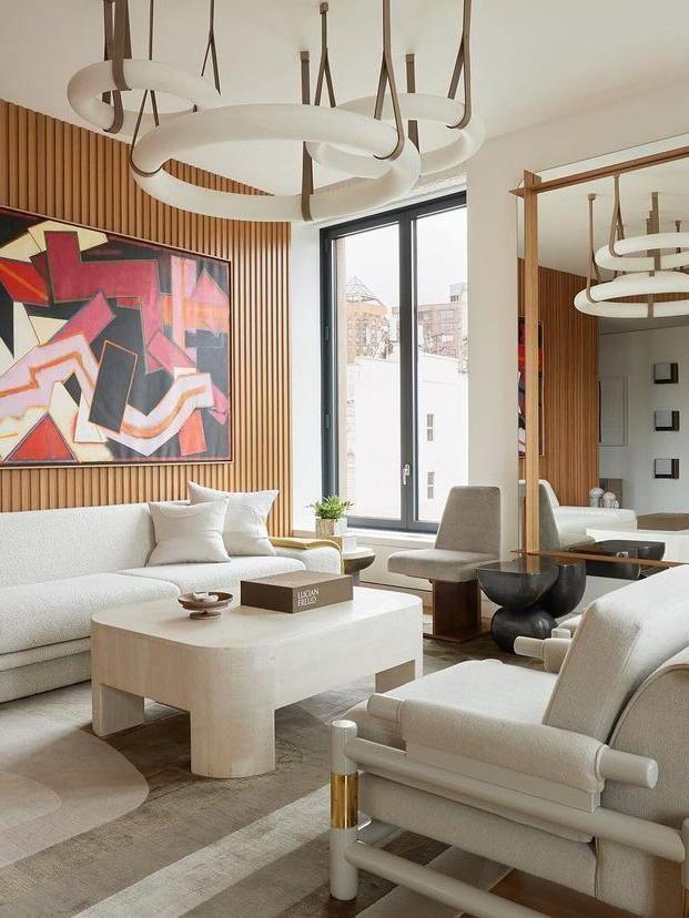 Suspended alabaster rings above lounge furniture