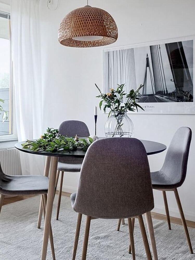 Bamboo dome pendant above a small round dining table