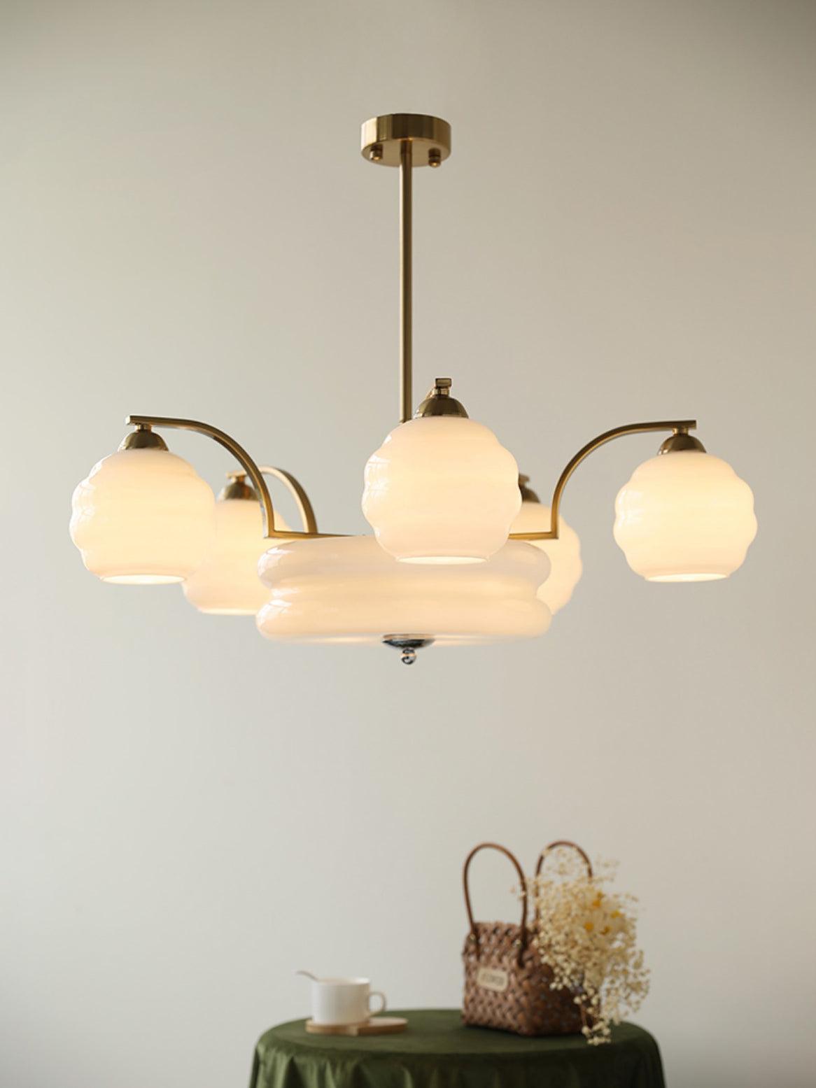 White glass chandelier against a pale wall