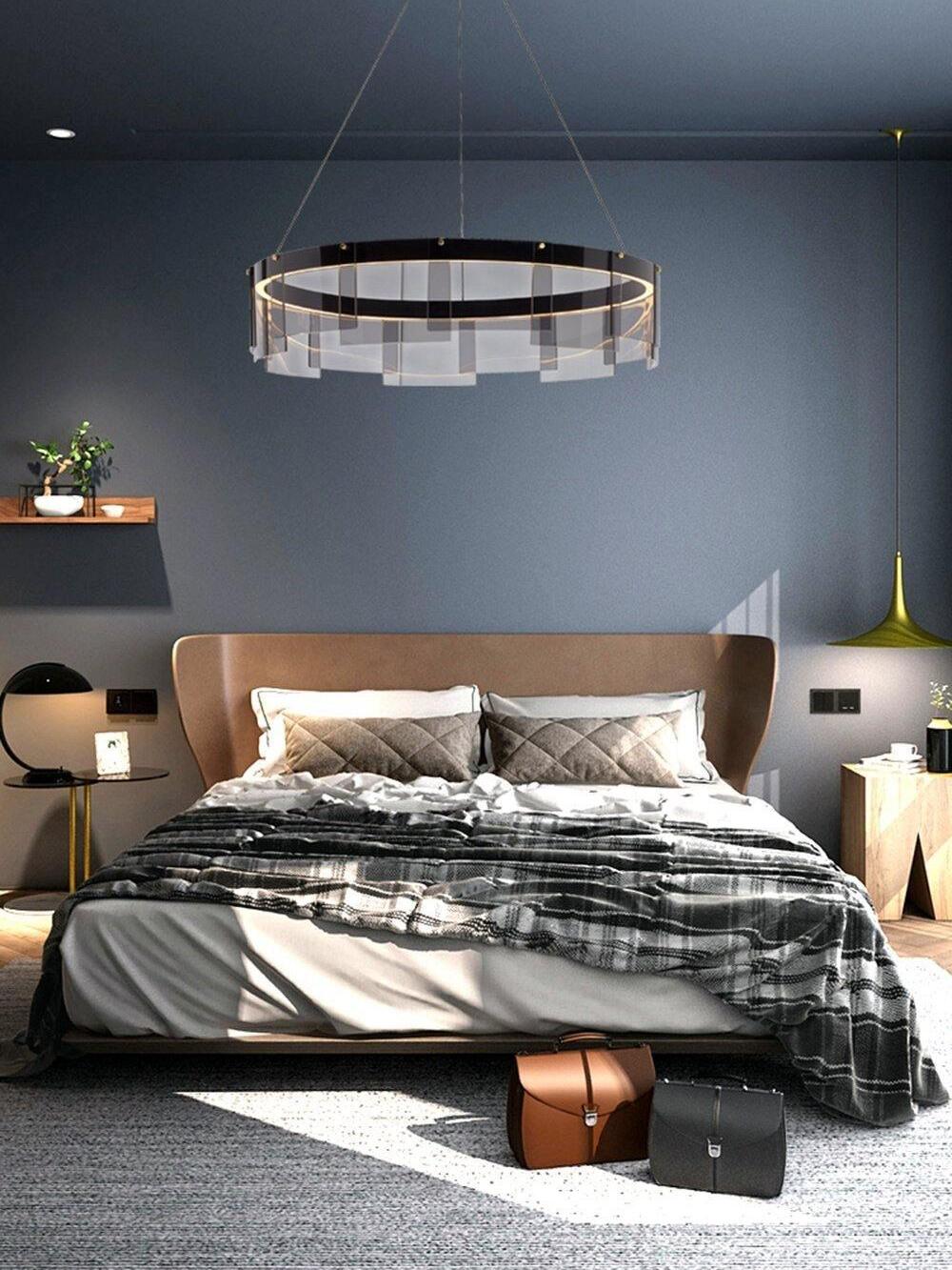 Stratos chandelier above a bed in a dark room