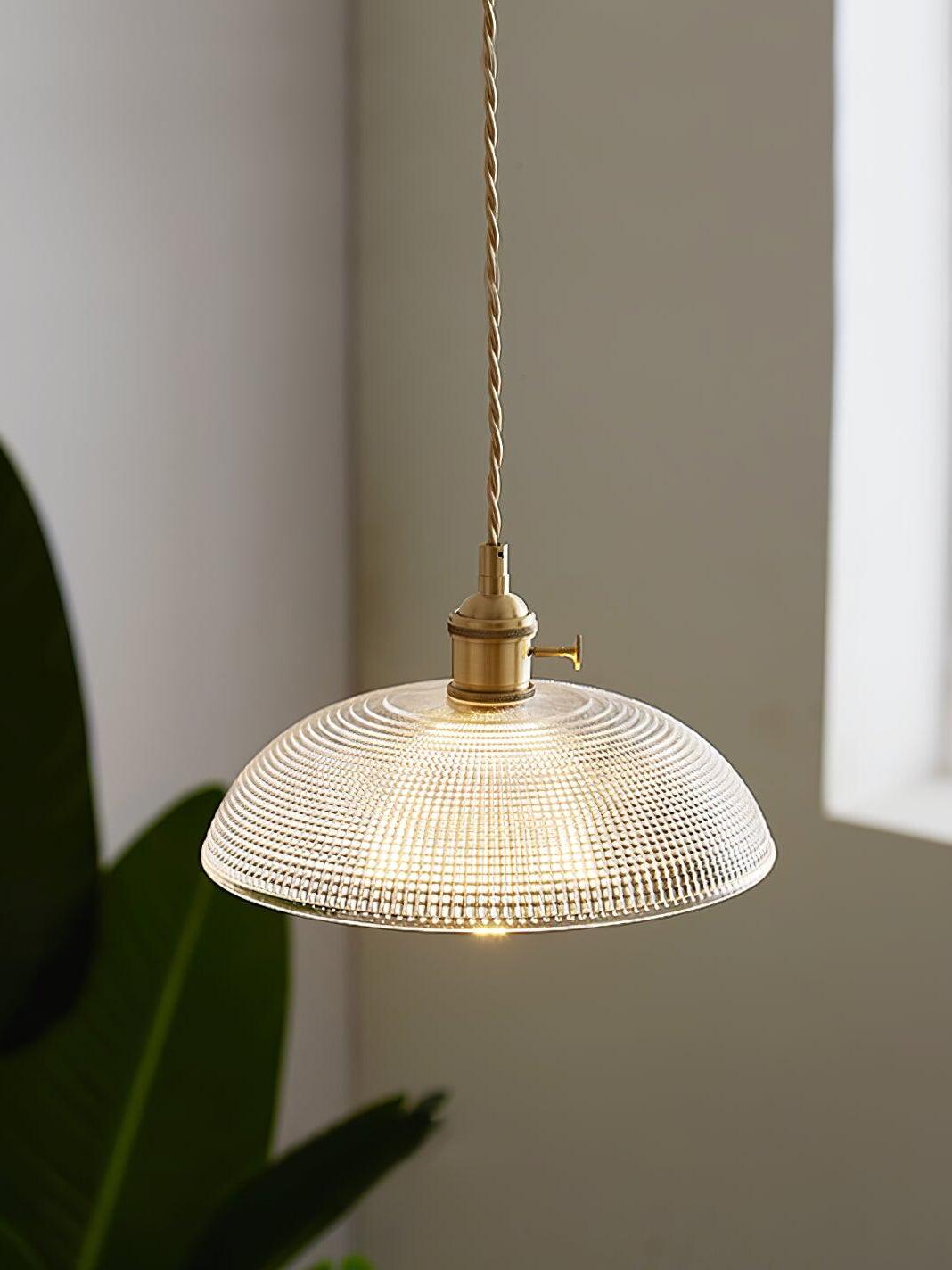 Lit patterned glass pendant by leaves