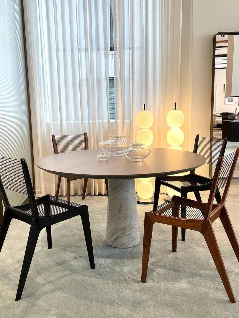 Two globe lamps beyond dining table