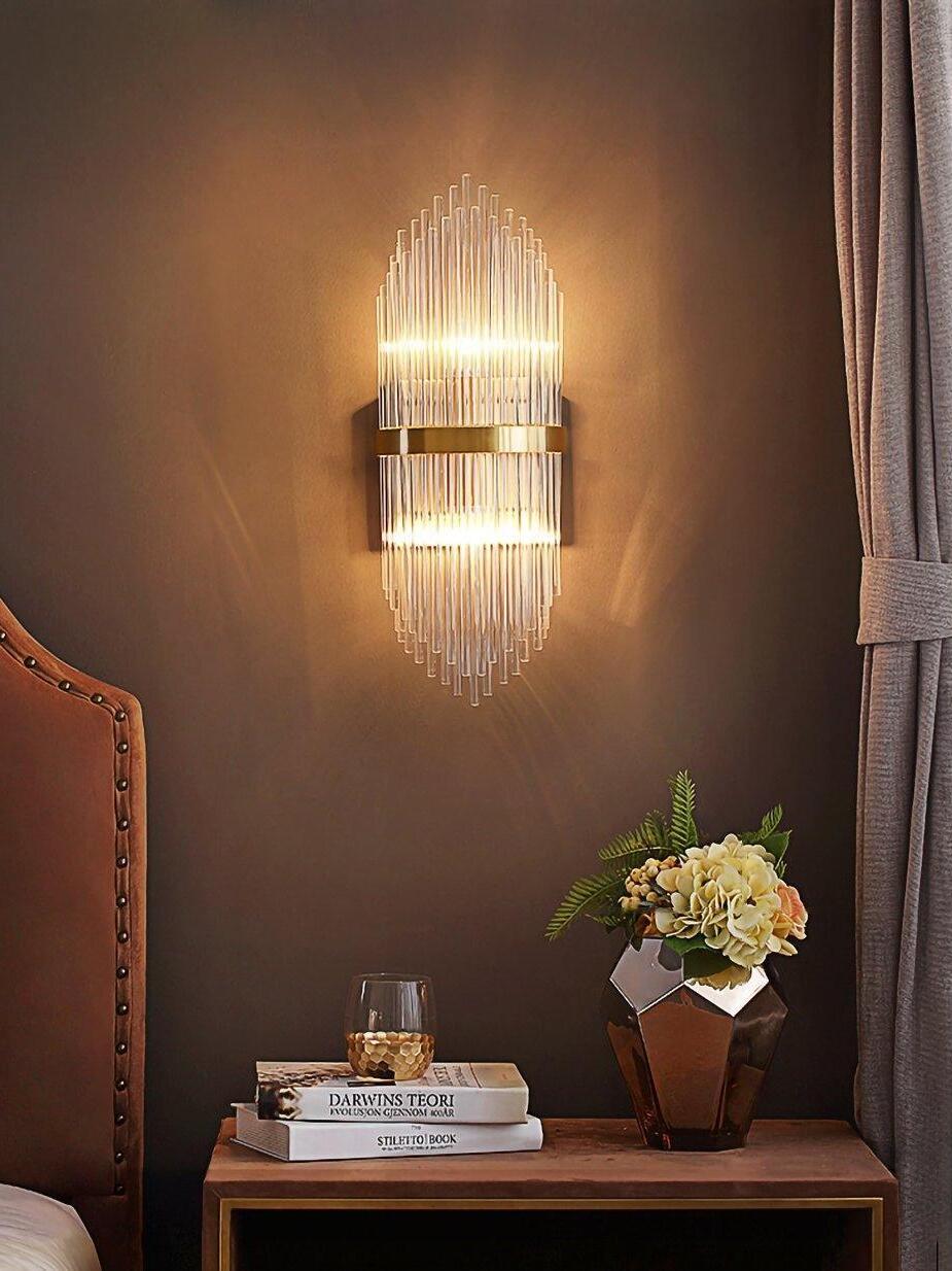 Lit vertical crystal wall light near bedside curtain