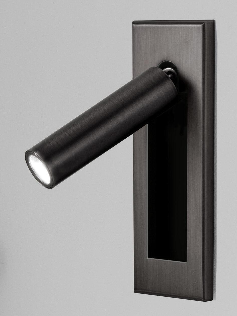 Matt black cylindrical reading head extended from a rectangular recessed plate