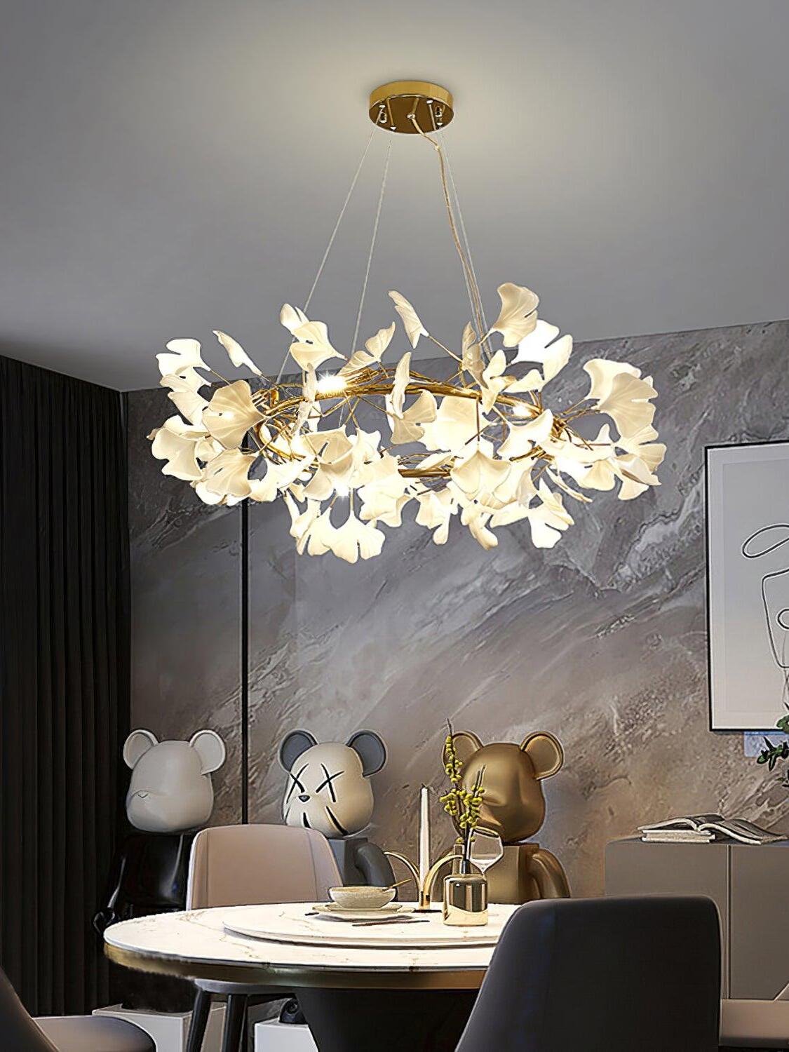 Gingko O leaf chandelier illuminated above a dining table