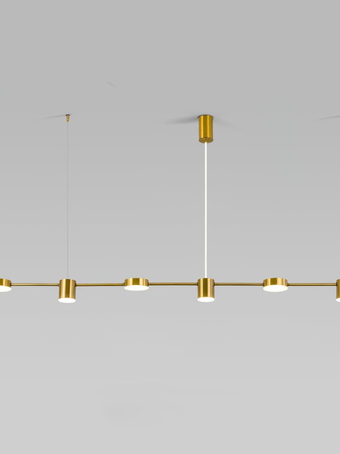 150 cm gold disc-and-cylinder pendant with a central ceiling canopy