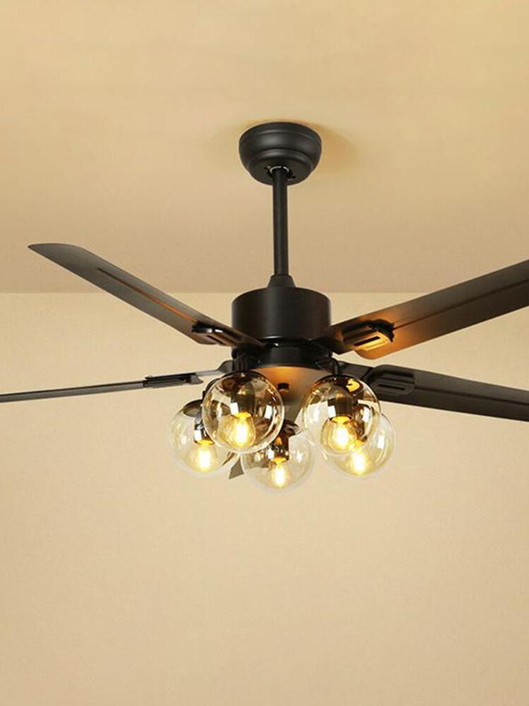 Black blades above warm-looking glass lights