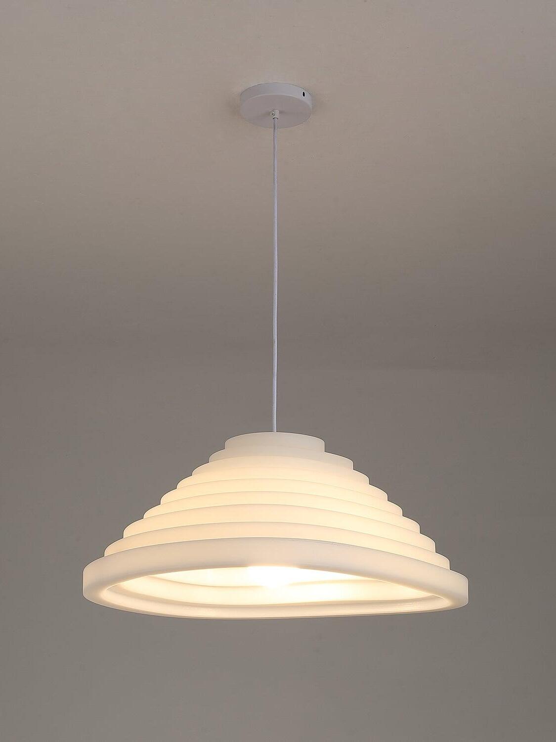 Round white stepped pendant lit with a warm-looking glow beneath a circular ceiling canopy.