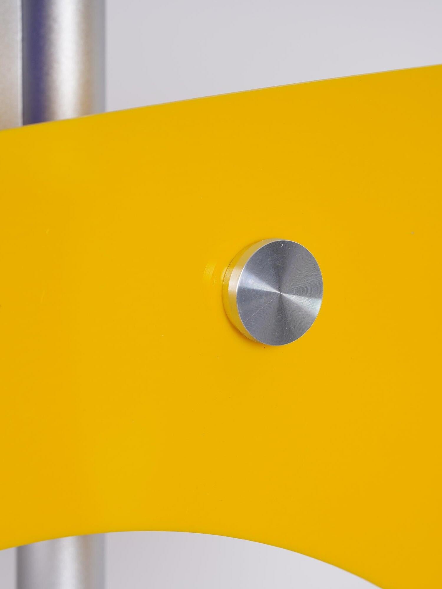 Yellow panel and metal fastener close-up
