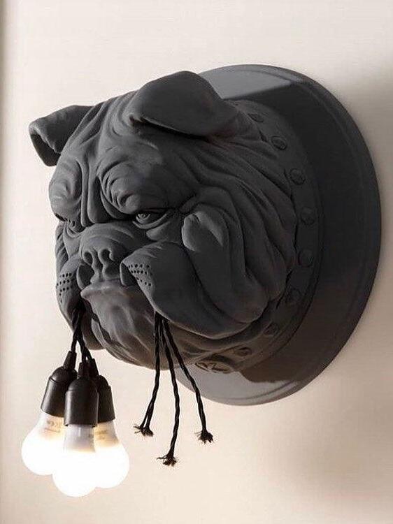 Dark bulldog sconce on a round wall plate