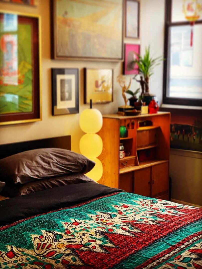 Globe floor lamp in colourful bedroom
