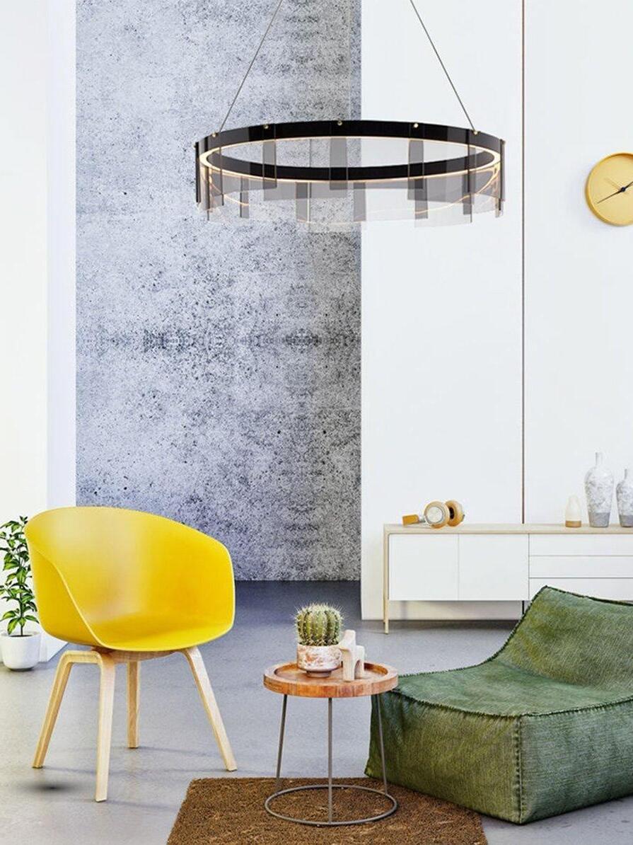 Ring chandelier in a lounge with yellow chair