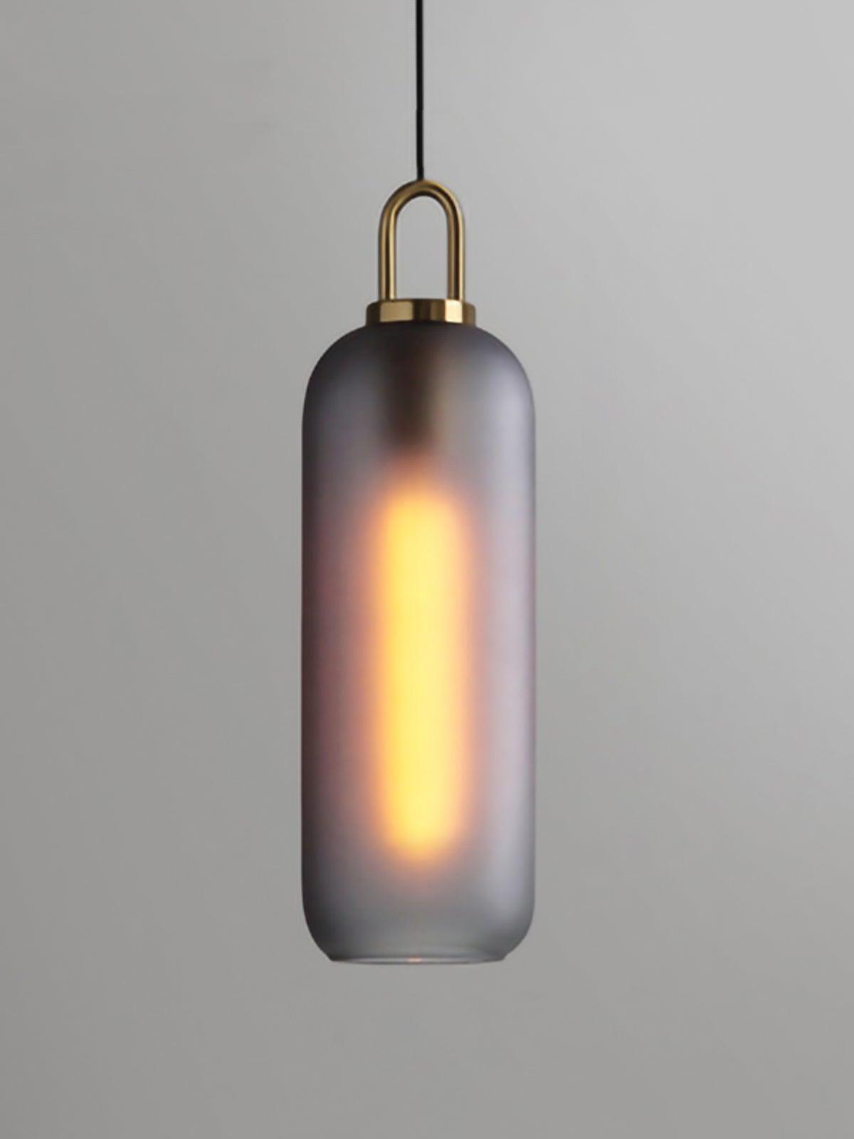 Long smoky frosted capsule shade beneath a metal top loop