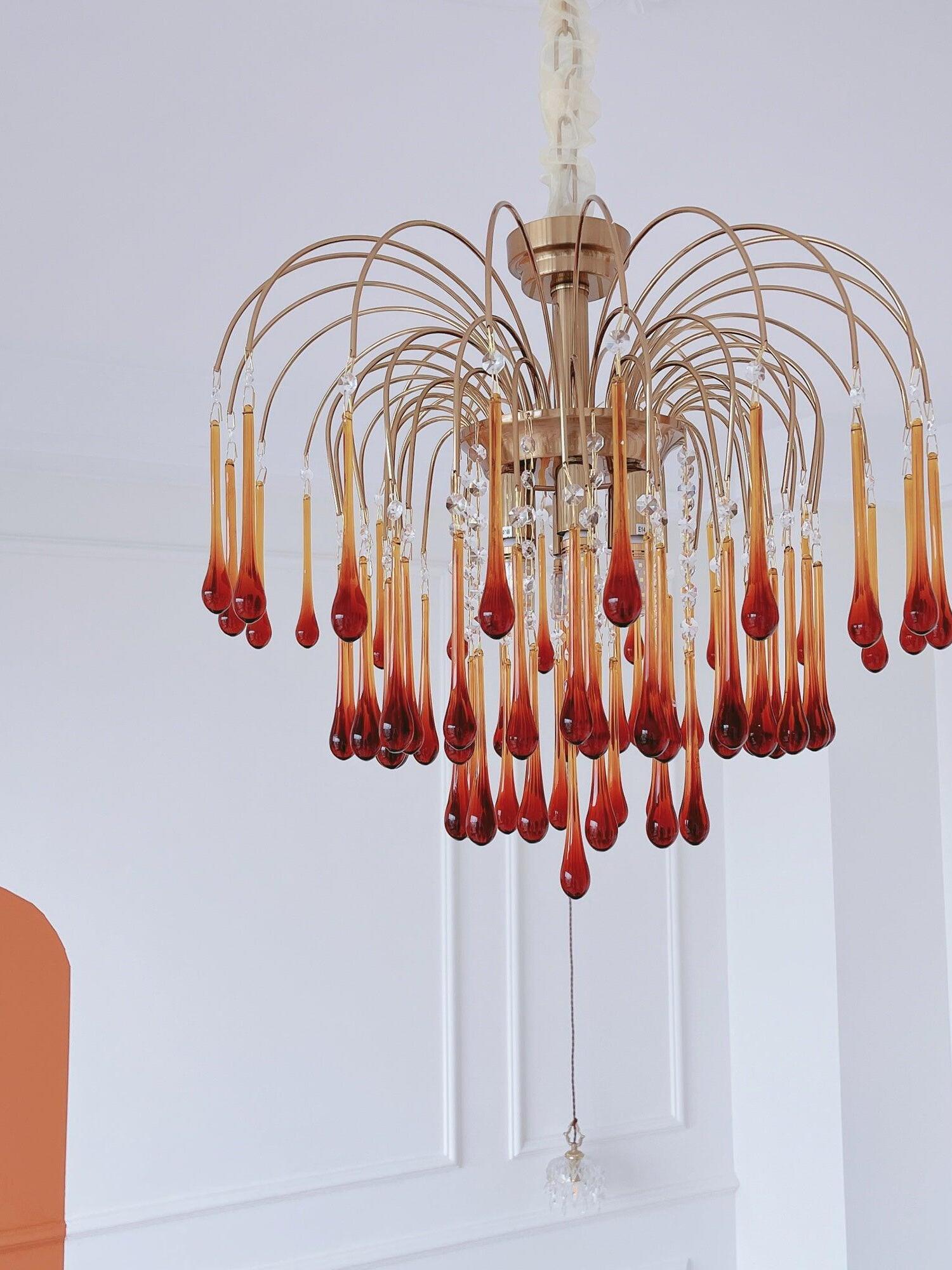 Amber crystal chandelier against a light wall