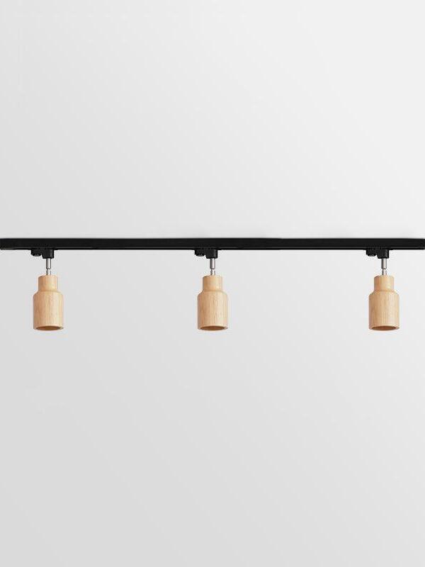 Three pale straight wooden spots on longer black bar