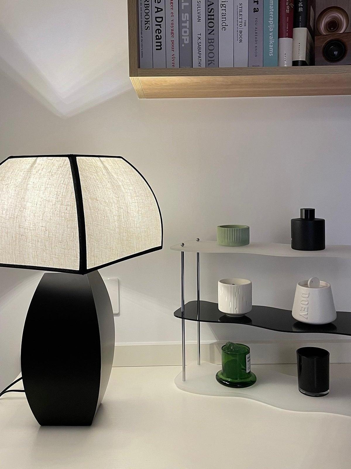 Javier lamp on white shelf beside small jars
