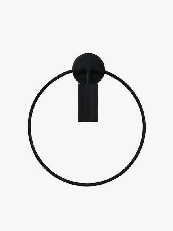 Black Revolta wall light with a circular frame, round wallplate and central cylindrical head.