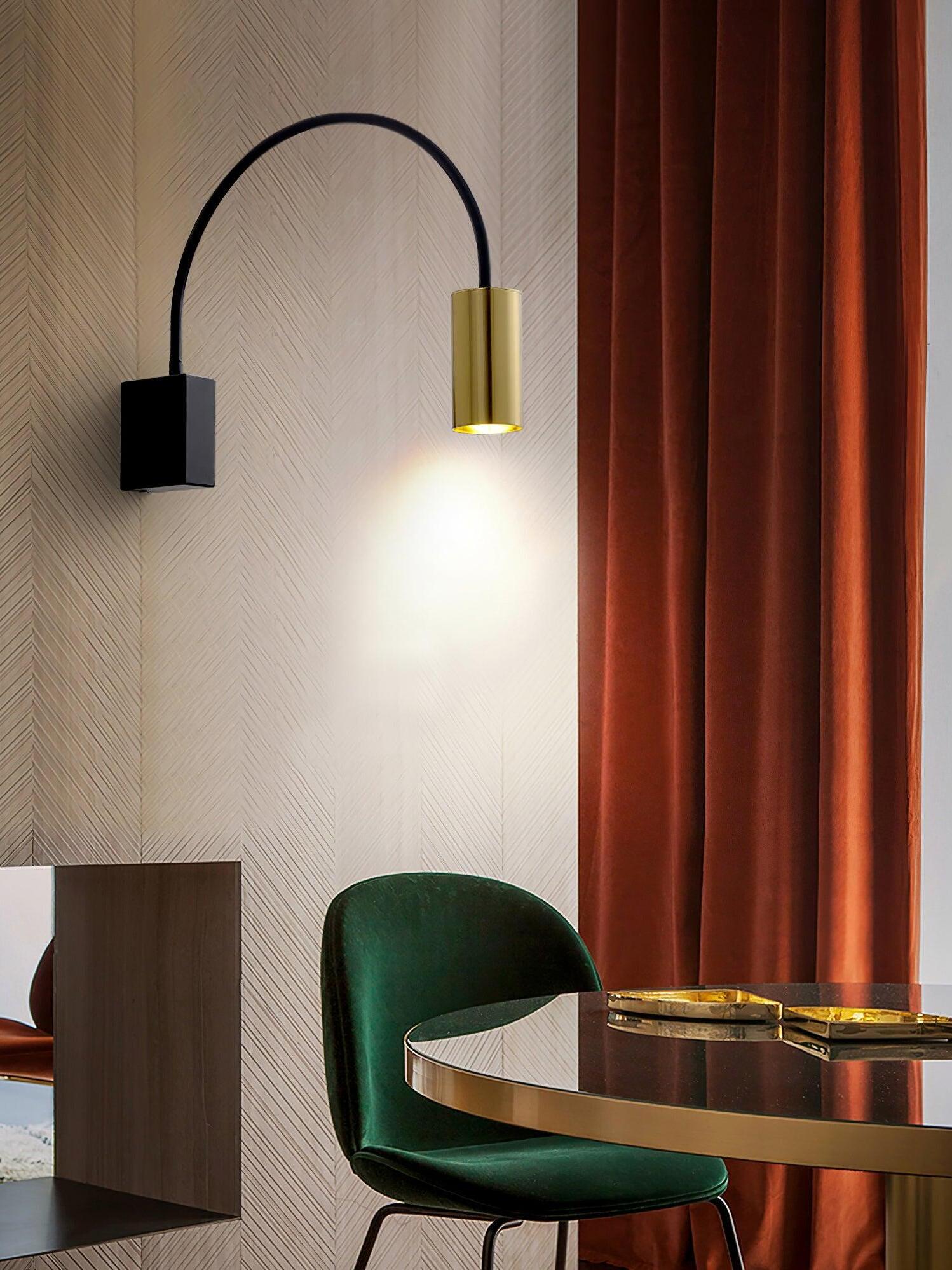 Antonella spotlight beside curtains and green seating