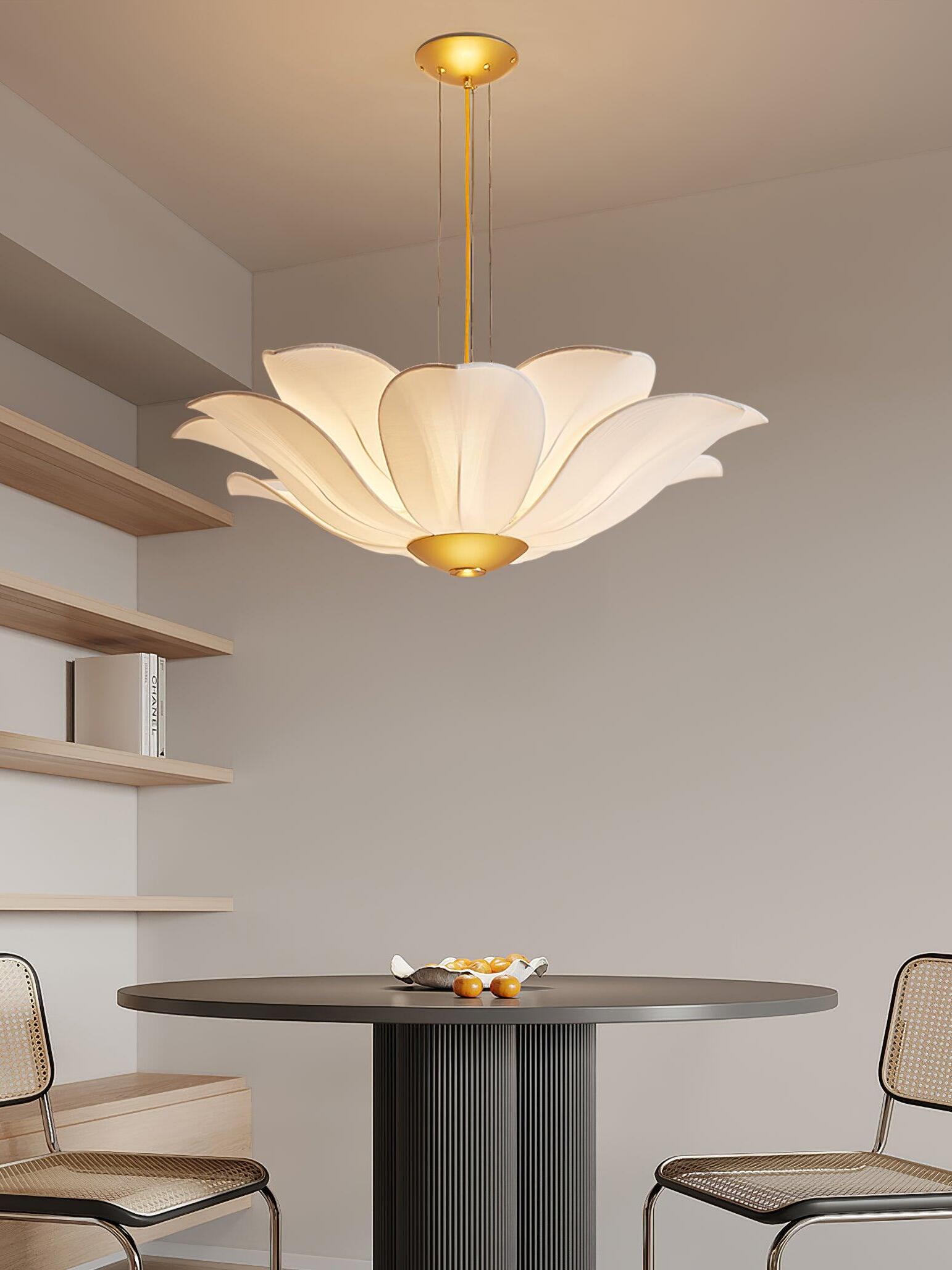 White and gold flower chandelier over round dining table
