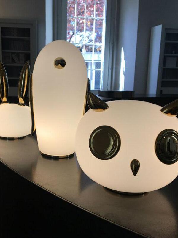 Foreground owl with penguin and cropped rabbit near window