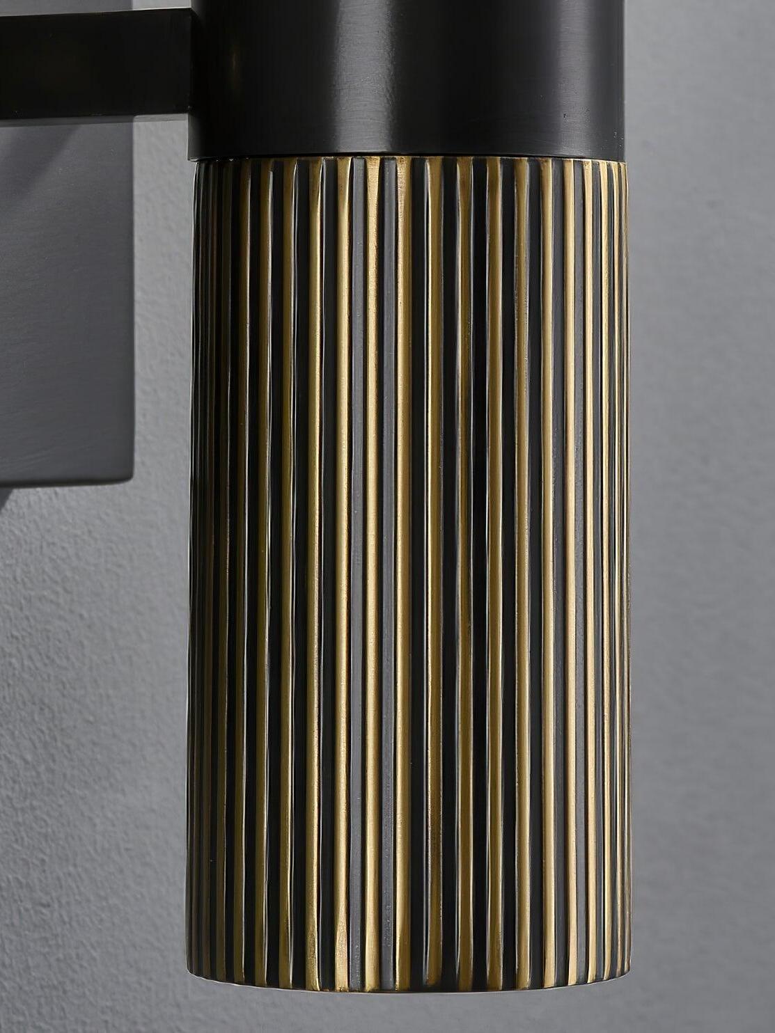 Ribbed metallic lower cylinder and dark upper collar
